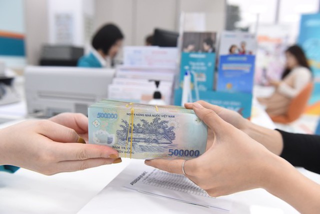 Hạ lãi suất, gỡ khó cho doanh nghiệp - Ảnh 1.