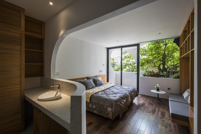 Ngôi nhà cắt khoét siêu art chiếm spotlight cả khu phố: Design bên trong xịn không kém, sân thượng chill như quán cafe - Ảnh 14.